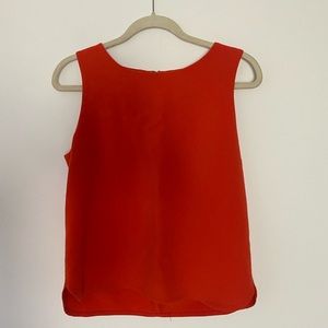 Professional orange sleeveless blouse